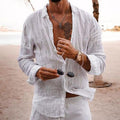 Model wearing long sleeve button front shirt in light beige – TARLANO