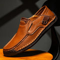Model wearing light brown leather loafer with tailored trousers – TARLANO