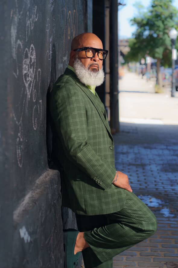 Model wearing olive windowpane plaid double breasted three-piece suit – TARLANO