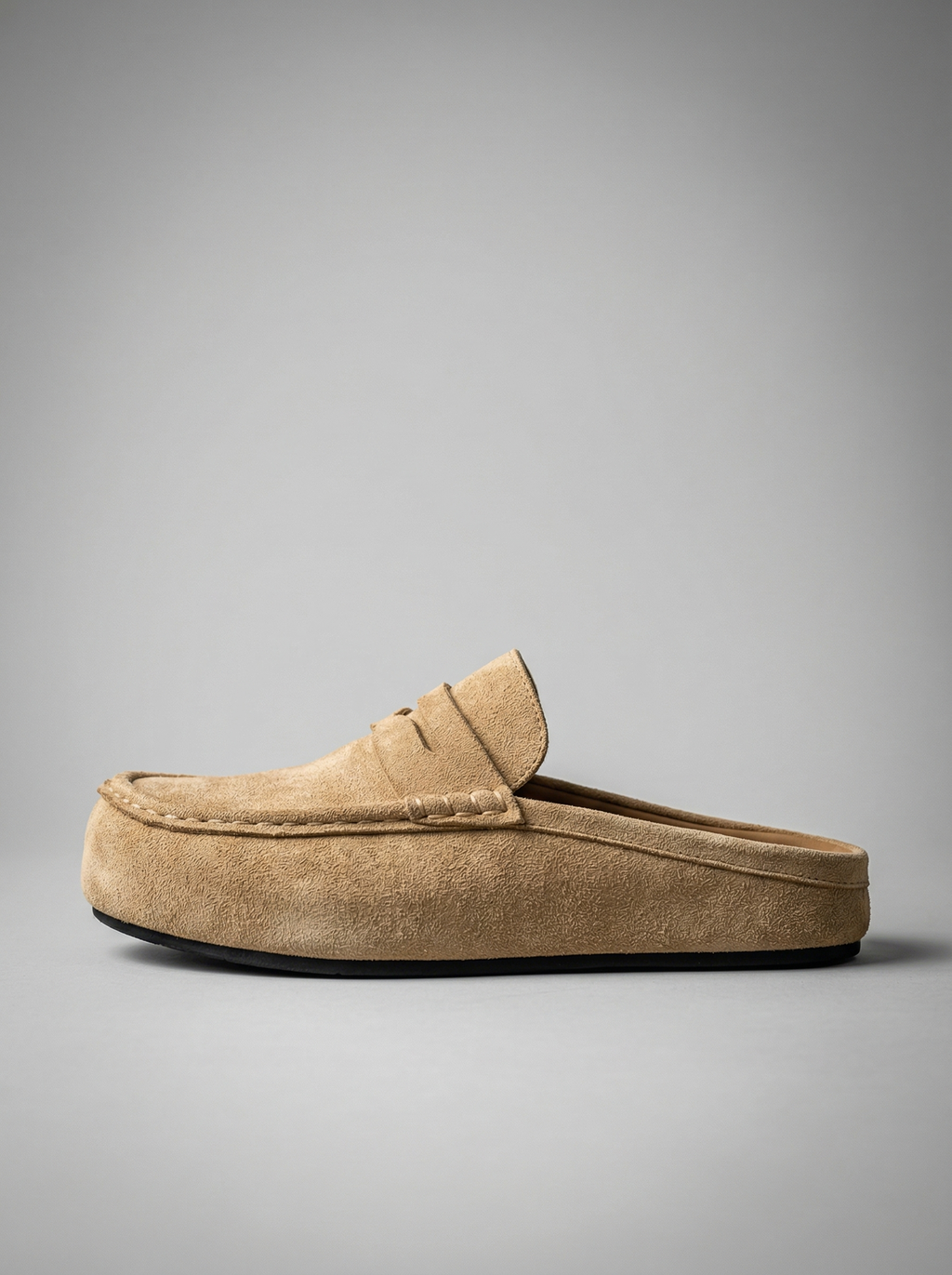 Close-up of penny strap mule loafer in beige with moc stitch apron toe – TARLANO